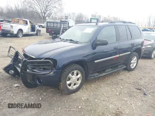 2007 GMC Envoy SLE with VIN 1GKDT13S372158038, listed as a IAAI auction lot 42103078 with 119,954 mi miles. Bid and sale history available at carsss.com. Image 2.