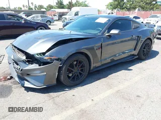 2019 Ford Mustang EcoBoost with VIN 1FA6P8TH5K5181274, listed as a IAAI auction lot 42719275 with 91,605 mi miles and . Bid and sale history available at DreamBid. Image 2.