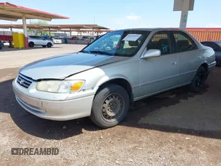 2001 Toyota Camry LE z VIN JT2BF22K710334750, wystawiony jako IAAI lot #42422525 z przebiegiem 273 999 mil mil oraz . Historia ofert i sprzedaży dostępna na DreamBid. Obrazek 2.