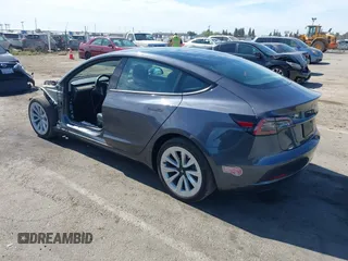 2023 Tesla Model 3 with VIN 5YJ3E1EAXPF652089, listed as a IAAI auction lot 42666520 with 17,679 mi miles and . Bid and sale history available at DreamBid. Image 3.