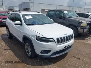 2019 Jeep Cherokee Latitude Plus with VIN 1C4PJMLB5KD198571, listed as a IAAI auction lot 42126995 with 124,230 mi miles. Bid and sale history available at carsss.com. Image 1.