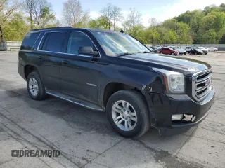 2015 GMC Yukon SLT with VIN 1GKS2BKC6FR145140, listed as a Copart auction lot 55451365 with 216,522 mi miles and Salvage Title. Bid and sale history available at DreamBid. Image 4.
