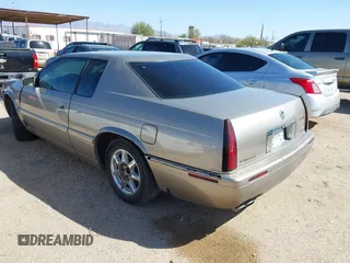 2001 Cadillac Eldorado Touring ETC z VIN 1G6ET12971B109319, wystawiony jako IAAI lot #41682779 z przebiegiem 147 515 mil mil oraz . Historia ofert i sprzedaży dostępna na DreamBid. Obrazek 3.
