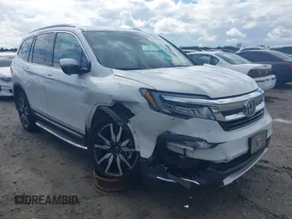 2020 Honda Pilot Elite with VIN 5FNYF6H08LB014288, listed as a IAAI auction lot 40496871 with 57,921 mi miles and . Bid and sale history available at DreamBid. Image 1.