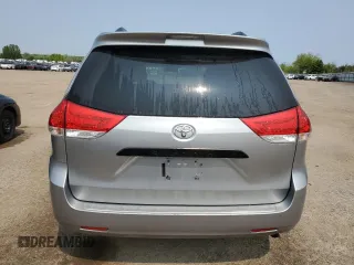 2014 Toyota Sienna L with VIN 5TDZK3DC8ES442973, listed as a Copart auction lot 59660055 with 310,496 mi miles and Salvage title. Bid and sale history available at DreamBid. Image 6.