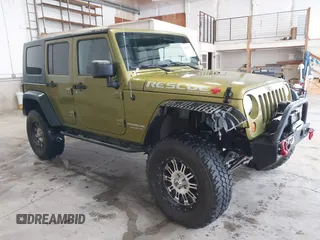 2007 Jeep Wrangler Unlimited Sahara z VIN 1J4GA59137L113030, wystawiony jako IAAI lot #41543512 z przebiegiem 164 337 mil mil oraz . Historia ofert i sprzedaży dostępna na DreamBid. Obrazek 1.