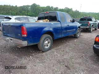 2002 Ford F-150 XL with VIN 1FTRX17W12NC06310, listed as a IAAI auction lot 42160213 with Not provided miles and . Bid and sale history available at DreamBid. Image 4.
