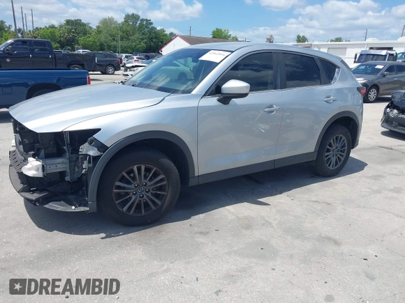 2017 Mazda CX-5 Sport with VIN JM3KFABLXH0135560, listed as a IAAI auction lot 42062016 with 153,416 mi miles. Bid and sale history available at carsss.com. Image 18.