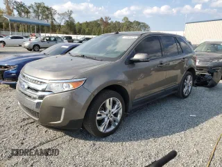 2014 Ford Edge SEL with VIN 2FMDK3J97EBA23061, listed as a Copart auction lot 73504374 with 127,205 mi miles and Salvage Title. Bid and sale history available at carsss.com. Image 1.