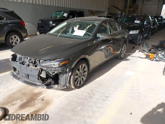2023 Mazda 3 S Premium with VIN 3MZBPBDM5PM374492, listed as a IAAI auction lot 42025207 with 12,344 mi miles and . Bid and sale history available at DreamBid. Image 2.