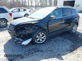2014 Ford Escape Titanium with VIN 1FMCU9JX2EUA96338, listed as a IAAI auction lot 41806850 with 127,745 mi miles. Bid and sale history available at carsss.com. Image 2.