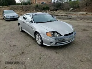 2003 Hyundai Tiburon GT z VIN KMHHN65F13U013420, wystawiony jako Copart lot #51234495 z przebiegiem 230 612 mil mil oraz Szkoda całkowita • Salvage title. Historia ofert i sprzedaży dostępna na DreamBid. Obrazek 11.