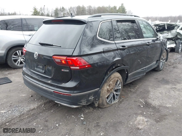 2020 Volkswagen Tiguan SE with VIN 3VV2B7AXXLM006852, listed as a IAAI auction lot 41847653 with 87,123 mi miles. Bid and sale history available at carsss.com. Image 4.