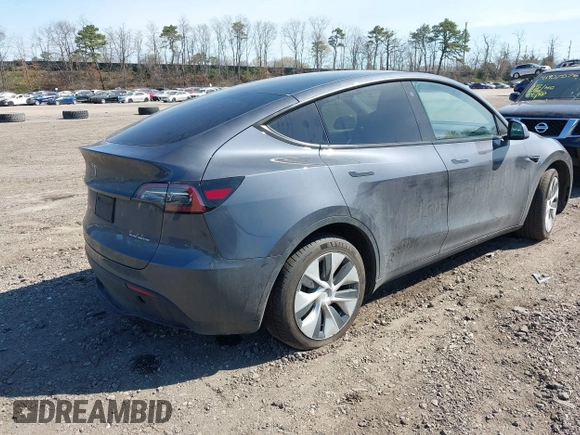 2022 Tesla Model Y Long Range with VIN 7SAYGDEE2NF460945, listed as a IAAI auction lot 41921645 with 62,318 mi miles and . Bid and sale history available at DreamBid. Image 4.