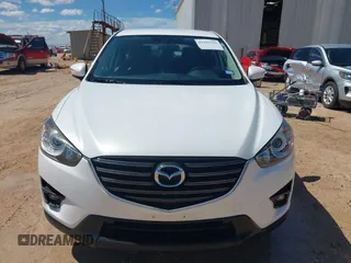 2016 Mazda CX-5 Touring z VIN JM3KE2CY0G0840918, wystawiony jako IAAI lot #42205529 z przebiegiem 74 515 mil mil oraz . Historia ofert i sprzedaży dostępna na DreamBid. Obrazek 12.