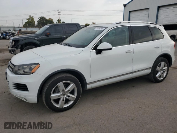 2013 Volkswagen Touareg Sport с VIN WVGEP9BP9DD003974, выставлен на аукционе Copart как лот 75106234 с пробегом 211 323 миль миль и Чистый • Clean title. История ставок и продаж доступна на DreamBid. Изображение 1.