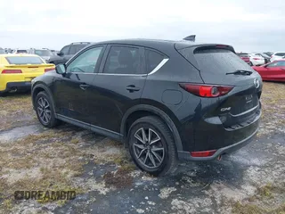 2018 Mazda CX-5 Touring with VIN JM3KFACM0J0315739, listed as a IAAI auction lot 40516262 with 60,727 mi miles. Bid and sale history available at carsss.com. Image 3.