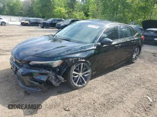 2023 Honda Civic Touring with VIN 2HGFE1F9XPH001929, listed as a Copart auction lot 60711185 with 64,080 mi miles and Clean title. Bid and sale history available at DreamBid. Image 1.