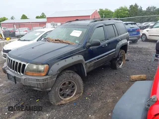 2001 Jeep Grand Cherokee Laredo z VIN 1J4GW48S91C698189, wystawiony jako IAAI lot #42315702 z przebiegiem 229 161 mil mil oraz . Historia ofert i sprzedaży dostępna na DreamBid. Obrazek 2.