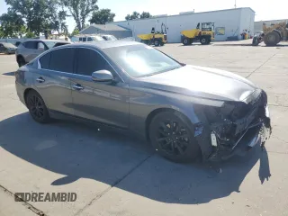 2014 Infiniti Q50 Premium with VIN JN1BV7AP2EM677469, listed as a Copart auction lot 61627125 with 106,670 mi miles and Salvage title. Bid and sale history available at DreamBid. Image 4.