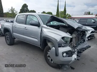 2021 Toyota Tacoma SR with VIN 3TMCZ5AN5MM400648, listed as a IAAI auction lot 42410503 with 72,021 mi miles and . Bid and sale history available at DreamBid. Image 1.