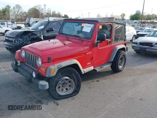 2003 Jeep Wrangler Sport with VIN 1J4FA49S13P320159, listed as a IAAI auction lot 41935699 with 212,355 mi miles. Bid and sale history available at carsss.com. Image 2.