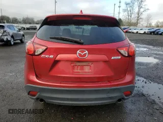 2014 Mazda CX-5 Touring с VIN JM3KE2CY3E0308740, выставлен на аукционе Copart как лот 88127365 с пробегом 137 690 миль миль и Списание • Salvage title. История ставок и продаж доступна на DreamBid. Изображение 6.