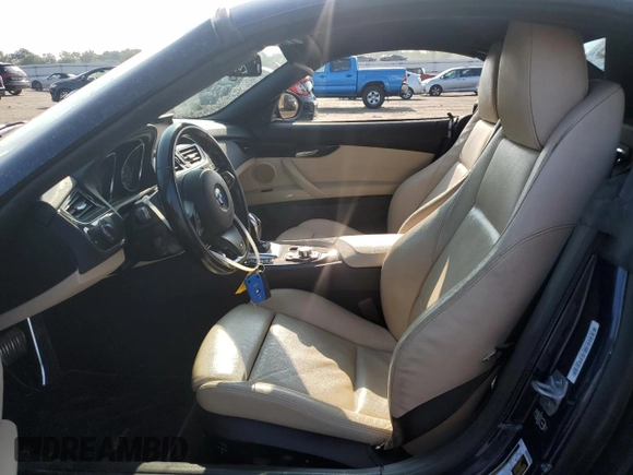 2014 BMW Z4 sDrive35is with VIN WBALM1C57EE634167, listed as a Copart auction lot 69088044 with 68,620 mi miles and Salvage title. Bid and sale history available at DreamBid. Image 7.