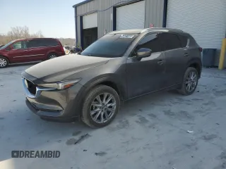 2021 Mazda CX-5 Grand Touring with VIN JM3KFBDM0M1464817, listed as a Copart auction lot 48821965 with 53,648 mi miles and Clean Title. Bid and sale history available at carsss.com. Image 1.