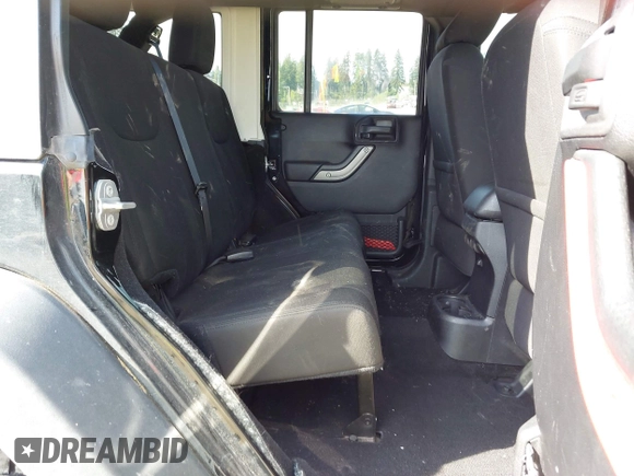 2015 Jeep Wrangler Unlimited Willys Wheeler with VIN 1C4BJWDG9FL750049, listed as a IAAI auction lot 42136188 with 115,328 mi miles and . Bid and sale history available at DreamBid. Image 8.