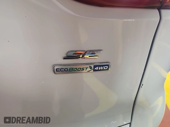 2014 Ford Escape SE z VIN 1FMCU9GX7EUC02600, wystawiony jako IAAI lot #42570755 z przebiegiem 86 871 mil mil oraz . Historia ofert i sprzedaży dostępna na DreamBid. Obrazek 22.