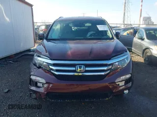 2016 Honda Pilot Touring with VIN 5FNYF6H90GB126572, listed as a IAAI auction lot 41872113 with 94,318 mi miles. Bid and sale history available at carsss.com. Image 12.