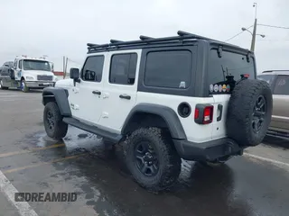 2018 Jeep Wrangler Unlimited Sport with VIN 1C4HJXDN0JW265823, listed as a IAAI auction lot 41707684 with 60,072 mi miles and . Bid and sale history available at DreamBid. Image 3.