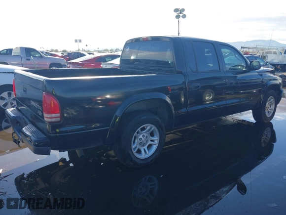2003 Dodge Dakota Sport with VIN 1D7HL38X53S381338, listed as a IAAI auction lot 38840426 with 130,846 mi miles. Bid and sale history available at carsss.com. Image 4.