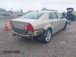 2011 Chevrolet Malibu 1LS with VIN 1G1ZB5E14BF326893, listed as a IAAI auction lot 42175943 with 163,887 mi miles and . Bid and sale history available at DreamBid. Image 4.