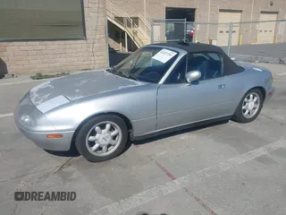 1991 Mazda MX-5 Miata Special Edition z VIN JM1NA3511M1235948, wystawiony jako IAAI lot #42322754 z przebiegiem 151 065 mil mil oraz . Historia ofert i sprzedaży dostępna na DreamBid. Obrazek 2.