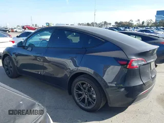 2025 Tesla Model Y Long Range with VIN 7SAYGDED2SF228414, listed as a IAAI auction lot 41706470 with 11,319 mi miles and . Bid and sale history available at DreamBid. Image 14.