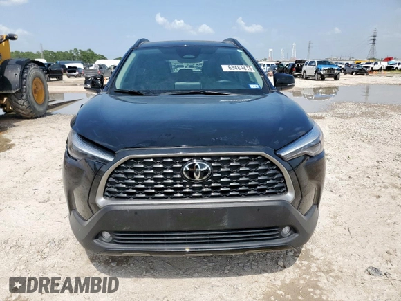 2023 Toyota Corolla Cross XLE with VIN 7MUDAAAG2PV072301, listed as a Copart auction lot 63484815 with 25,017 mi miles and Salvage title. Bid and sale history available at DreamBid. Image 5.