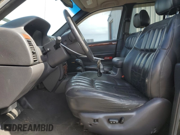 1999 Jeep Grand Cherokee Limited with VIN 1J4GW68N4XC679841, listed as a Copart auction lot 59760015 with 155,366 mi miles and Salvage title. Bid and sale history available at DreamBid. Image 7.