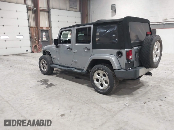 2014 Jeep Wrangler Unlimited Sahara with VIN 1C4BJWEG5EL164350, listed as a IAAI auction lot 42018586 with 113,222 mi miles. Bid and sale history available at carsss.com. Image 3.