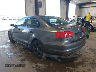 2014 Volkswagen Jetta Sedan S with VIN 3VW2K7AJ5EM410491, listed as a IAAI auction lot 42083614 with 65,960 mi miles. Bid and sale history available at carsss.com. Image 3.