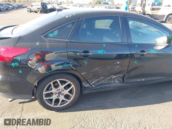 2015 Ford Focus SE with VIN 1FADP3F22FL306055, listed as a IAAI auction lot 41966475 with 139,228 mi miles. Bid and sale history available at carsss.com. Image 6.