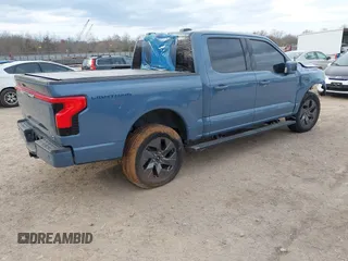 2023 Ford F-150 Lightning Pro with VIN 1FT6W1EVXPWG34958, listed as a IAAI auction lot 41732898 with 10,573 mi miles and . Bid and sale history available at DreamBid. Image 4.