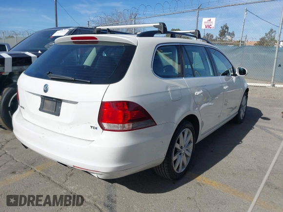 2012 Volkswagen Jetta SportWagen TDI with VIN 3VWPL7AJ0CM688196, listed as a IAAI auction lot 41428539 with 144,192 mi miles. Bid and sale history available at carsss.com. Image 4.