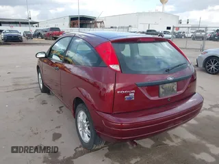 2007 Ford Focus S z VIN 1FAFP31N27W231884, wystawiony jako IAAI lot #41138534 z przebiegiem 84 506 mil mil oraz . Historia ofert i sprzedaży dostępna na DreamBid. Obrazek 3.