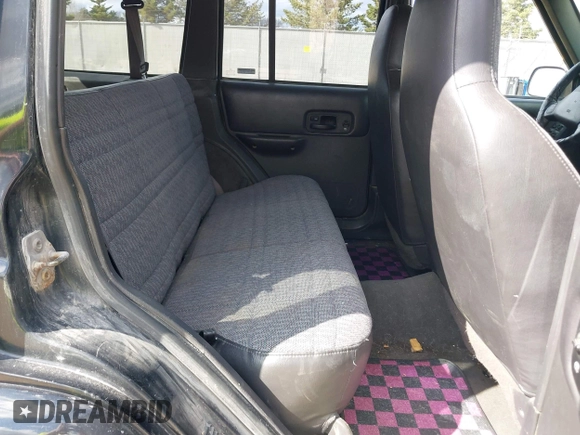 2000 Jeep Cherokee z VIN 1J4FF48S7YL153811, wystawiony jako IAAI lot #42098752 z przebiegiem 213 988 mil mil oraz . Historia ofert i sprzedaży dostępna na DreamBid. Obrazek 8.