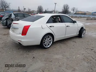 2014 Cadillac CTS Luxury AWD with VIN 1G6AX5S33E0156239, listed as a IAAI auction lot 41452922 with Not Provided miles and . Bid and sale history available at DreamBid. Image 4.