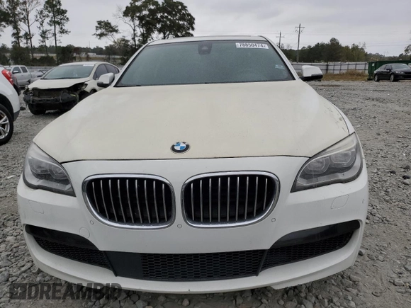 2015 BMW 7 Series 750i z VIN WBAYA8C5XFD825662, wystawiony jako Copart lot #78850474 z przebiegiem 153 080 mil mil oraz Czysty tytuł • Clean title. Historia ofert i sprzedaży dostępna na DreamBid. Obrazek 5.