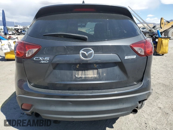 2015 Mazda CX-5 Grand Touring with VIN JM3KE4DY9F0536771, listed as a Copart auction lot 51801775 with 88,529 mi miles and Salvage Title. Bid and sale history available at DreamBid. Image 6.