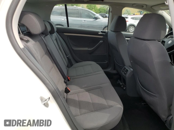 2009 Volkswagen Rabbit S with VIN WVWDB71K79W085935, listed as a Copart auction lot 60697594 with 102,780 mi miles and Salvage title. Bid and sale history available at DreamBid. Image 10.